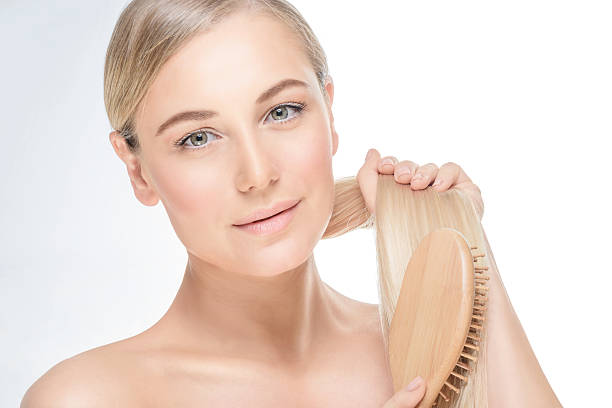 istock Gentle female combing her hair 622969162