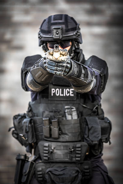 istock SWAT Police Officer Against Brick Wall 622969274