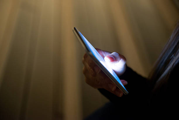 istock Closeup image of female hands using modern smartphone at night 622970896