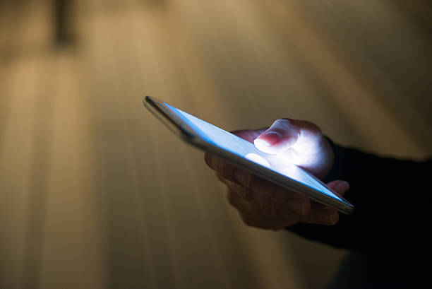 people concept - young woman texting on smartphone at night