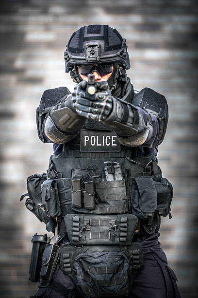 istock SWAT Police Officer Against Brick Wall 622972858