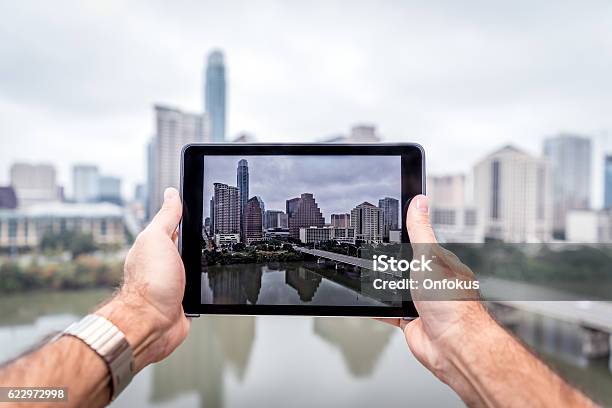 Human Hands Holding A Digital Tablet In Austin Texas Stock Photo - Download Image Now