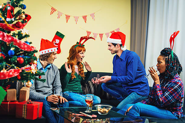 istock Young man asking his girlfirend to marry him on Christmas 622973272