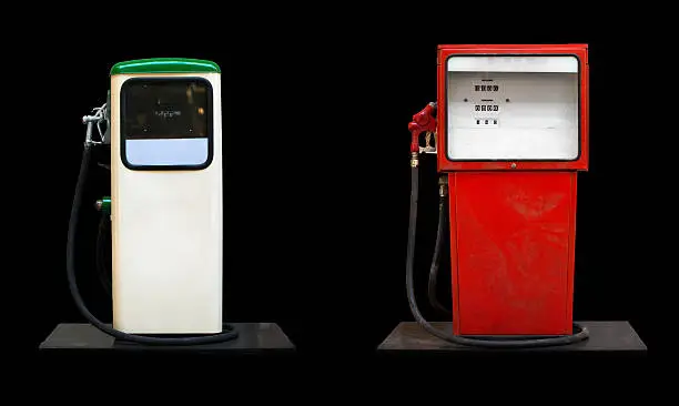 Two retro gas stations isolated on black.