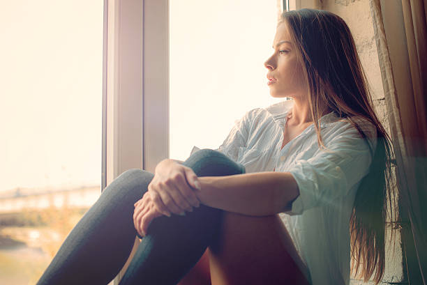 istock Beautiful girl on window 622976644