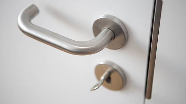 istock closeup of white door with silver door handle 622979350