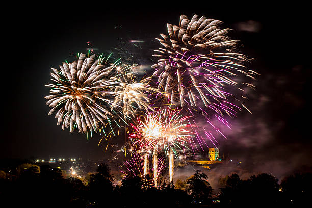 Real colourful fireworks Real colourful fireworks launched above the town. firework explosive material photos stock pictures, royalty-free photos & images