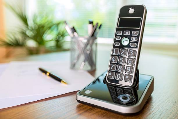 Telephone Wireless Telephone on a Wooden Desk cordless phone stock pictures, royalty-free photos & images