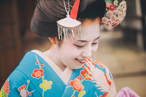 istock Smiling Geisha. Focus in on the eye. 622981620