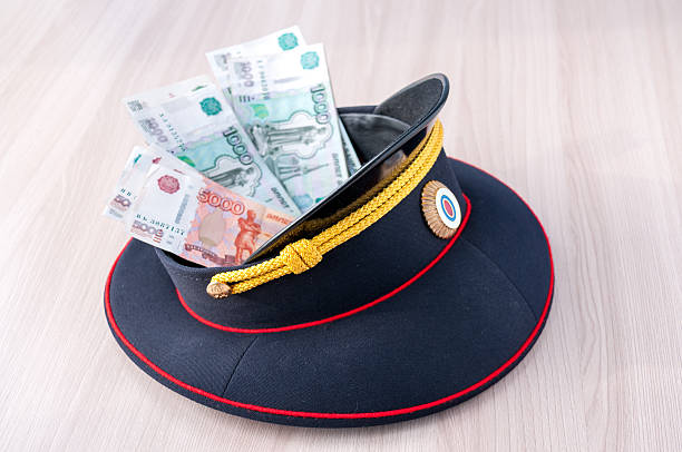 istock Money lying in a police cap on the table 622981928