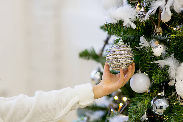 istock Girl decorate the Christmas tree 622985816
