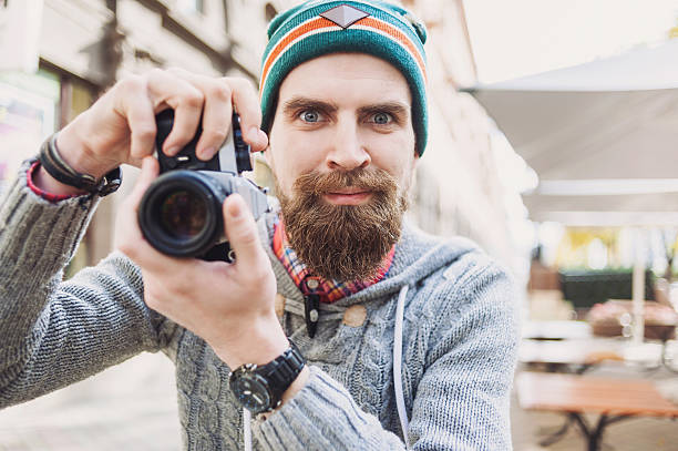 istock Young man photographer taking pictures 622986838