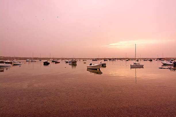 Formentera winter sunset moored boats in October in Formentera, Balearic islands, Spain.