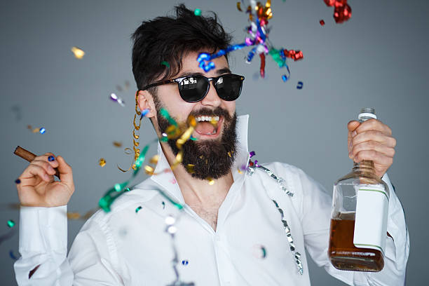 istock Happy smiling new years eve celebrating man 622988444