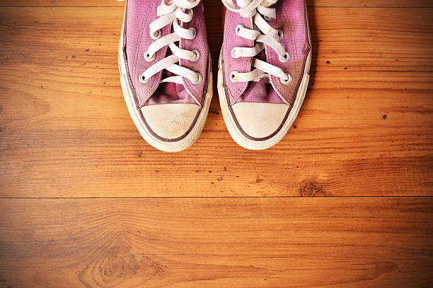 istock shoes standing on wood background 622989280