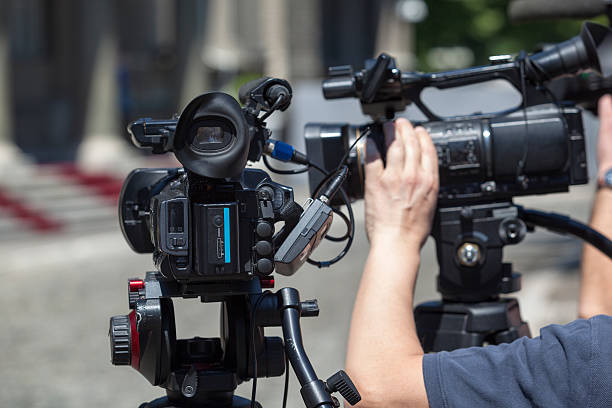 istock Filming an event with a video camera 622990912