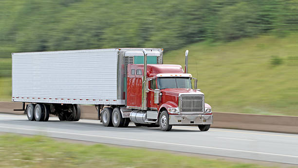 istock Semi Tractor Trailer Truck On Highway, Blurred Background 622991090