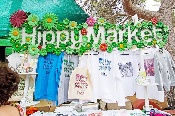 Es Canar, Ibiza, Balearic islands, Spain - October 26, 2016: Hippy Market sign in Es Canar Punta Arabi with flowers and fashion souvenirs on an overcast autumn day in October.