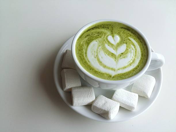 cup of matcha latte art so delicious on white background