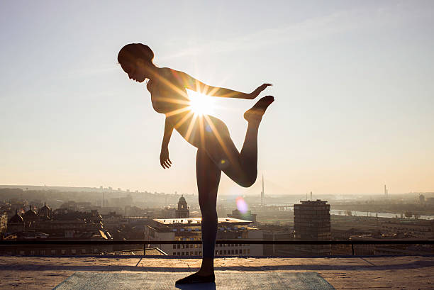 istock woman stretching on the rooftop before working out 622992354