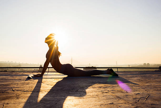 image of a woman stretching on the rooftop