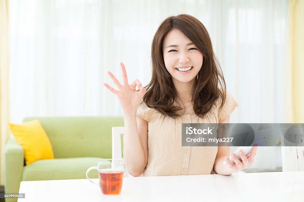 Woman using a smartphone Adult Stock Photo