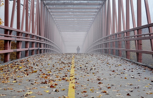 Pedestrian bridge /bike trial in Chicago suburbs. Picture taken in foggy November morning. 