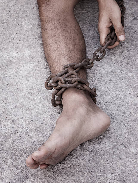 istock Leg of the prisoners were bound with chains. 622995850
