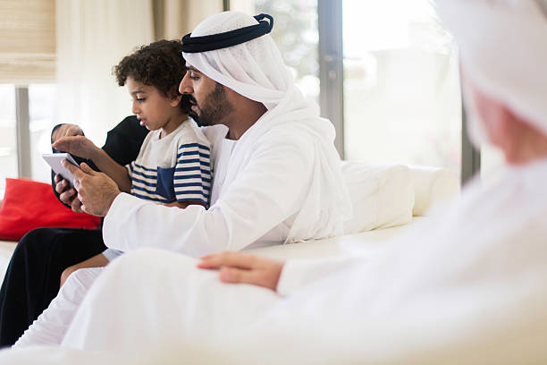 istock Family portrait sitting in the sofa. 623058360