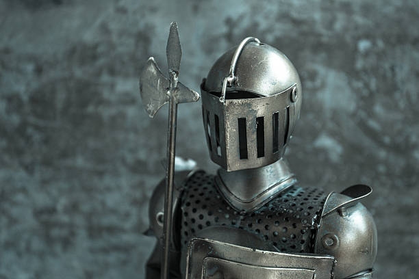istock Knight, a tin soldier, toy with grunge background 623059240
