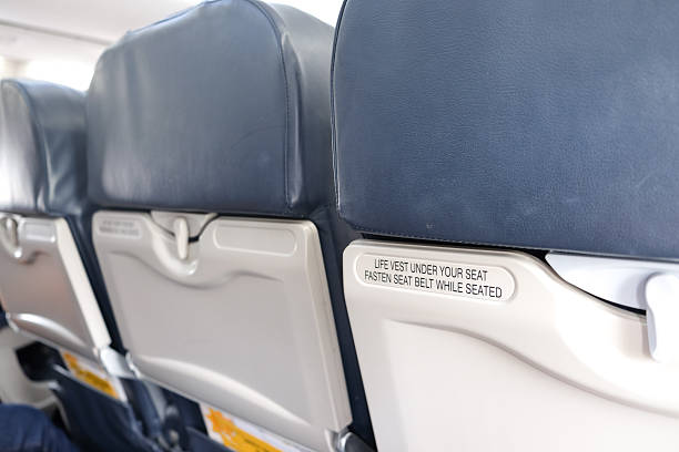 istock airplane seat with life vest under your seat text 623059708