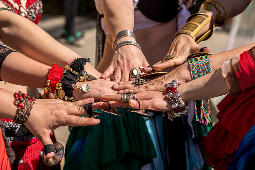 Many dancer´s hands together showing unity before going dancing.