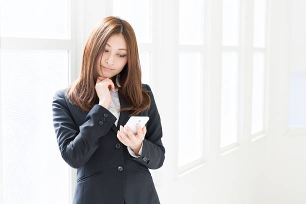 istock Businesswoman using a smartphone 623060006