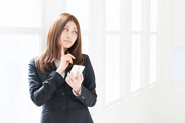 istock Businesswoman using a smartphone 623060120