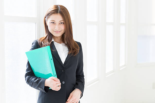 istock Businesswoman holding a folder 623060748