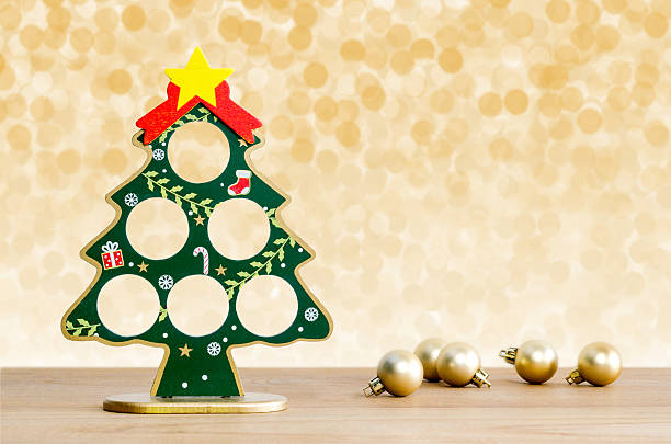 Christmas background. Christmas tree and golden balls. Christmas background. Christmas tree and golden balls with lights snow winter background. Diy Mobile Frame with Christmas Tree stock pictures, royalty-free photos & images
