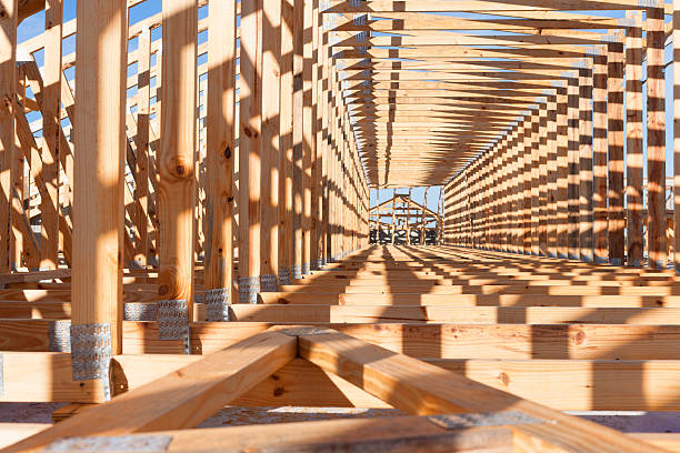 Framing of exterior walls on a construction site.