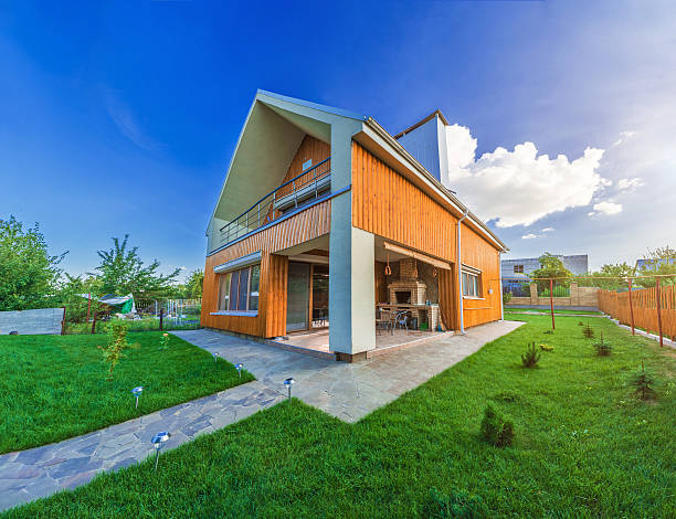 istock Beautiful wooden house with a lawn. 623065014