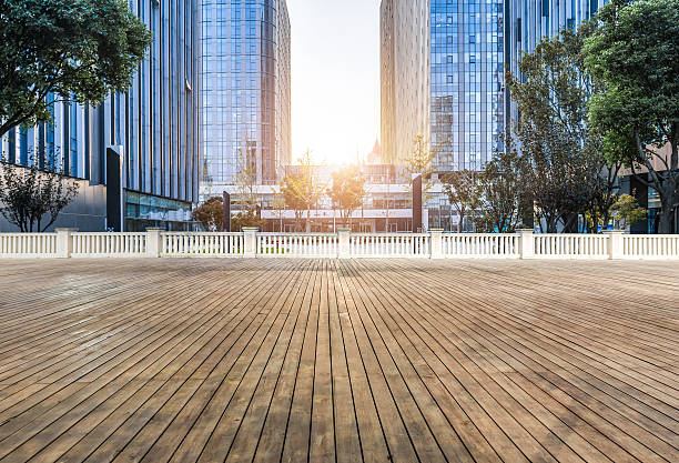 istock Empty wood floor with modern business office building 623065594