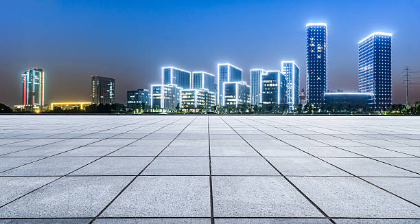 istock Panoramic empty floor with modern business office building at night 623066902