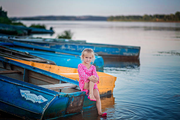 istock Little girl sitting on boat 623066940