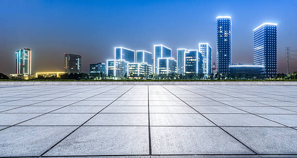 istock Panoramic empty floor with modern business office building at night 623067080