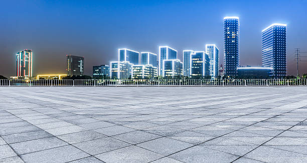 istock Panoramic empty floor with modern business office building at night 623067256