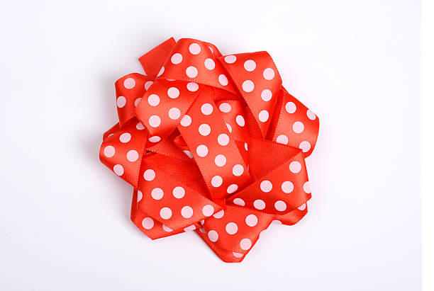 Shiny Coral silk ribbon isolated on white background. Festive concept. Flat lay. Color of year 2019.
