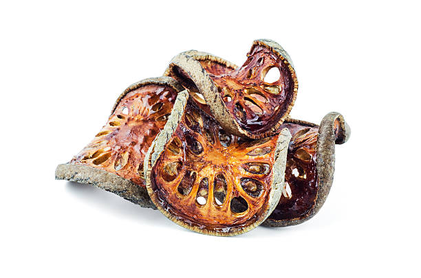 istock Dried Bael Fruit tea (Aegle marmelos) isolated on white backgrou 623067370