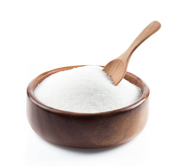 istock White sugar in wood bowl on white background 623067462