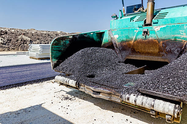 istock Front end of tarmac road laying machine. Asphalt spreader 623068432