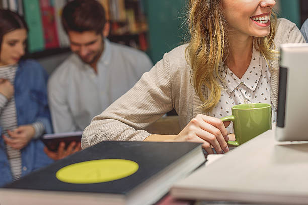 istock Friends studying together at coffee shop 623069114