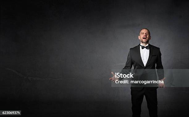 Classical Singer Gestures With Hands Stock Photo - Download Image Now - Opera, Men, Tuxedo