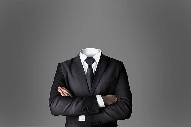 istock businessman without head crossed arms grey background 623071756